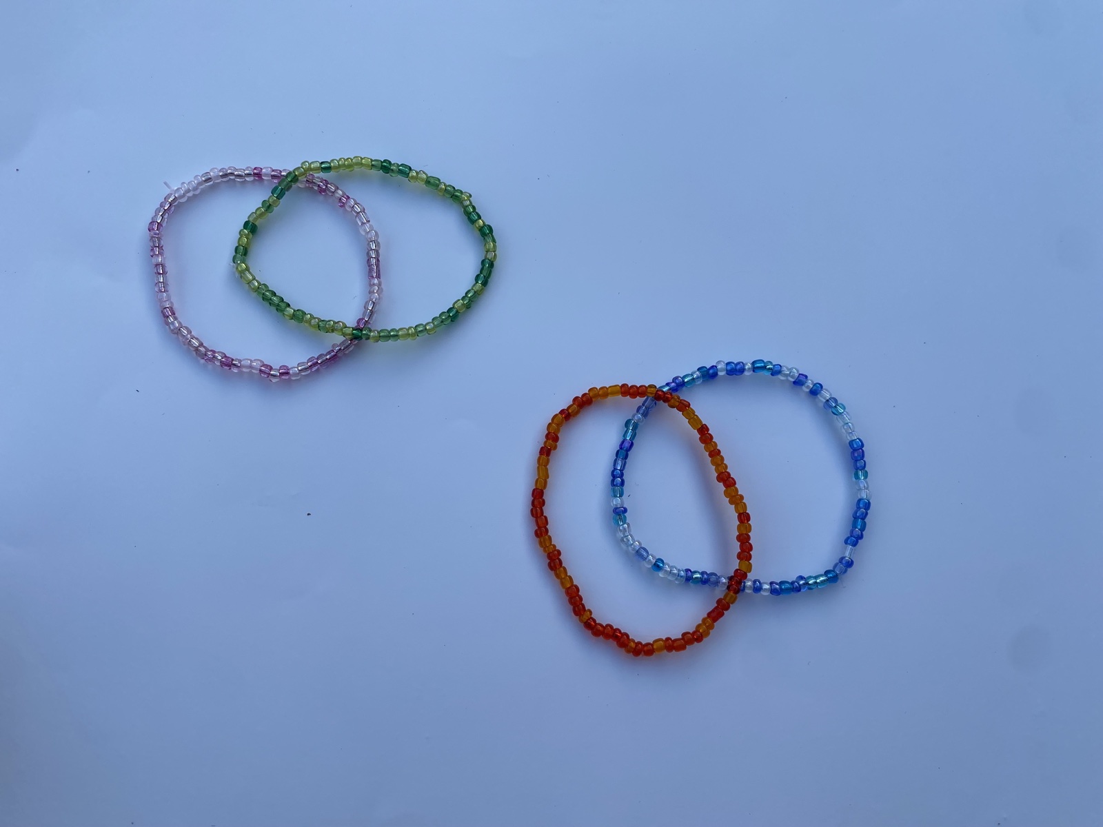 Four colourful beaded bracelets handmade by Alice