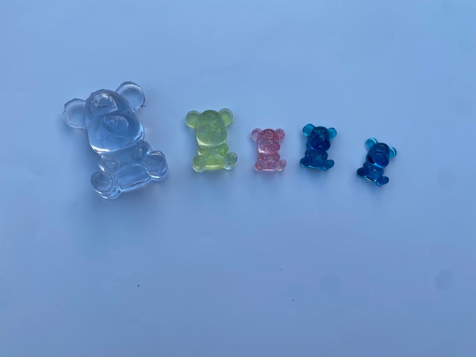 Clear, yellow, pink and blue resin bears handmade by Alice
